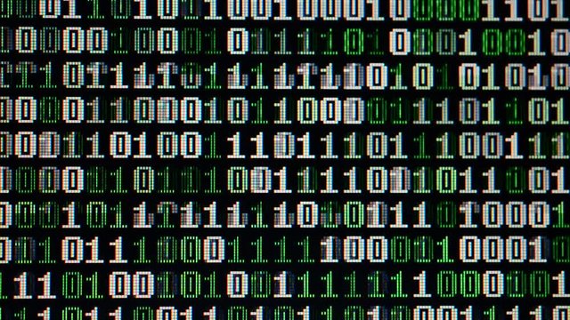 Binary code on the monitor screen.