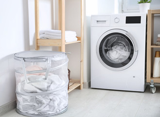 Laundry basket and washing machine indoors