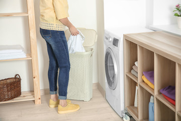 Woman doing laundry at home