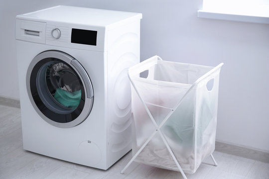 Laundry basket and washing machine indoors