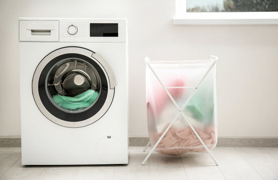 Laundry basket and washing machine indoors
