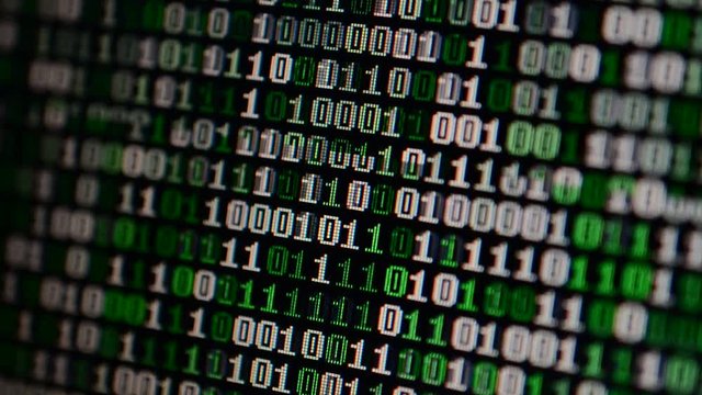 Binary code on the monitor screen.