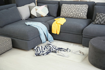 Dirty laundry scattered in living room
