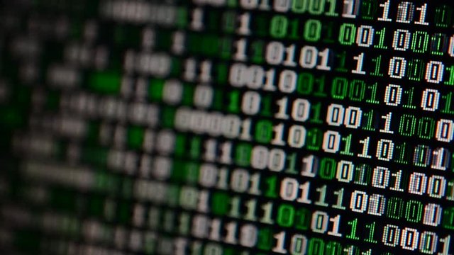 Binary code on the monitor screen.