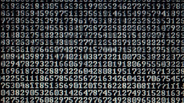 Binary code on the monitor screen.