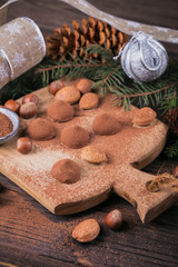 Homemade chocolate truffles, nuts, almonds and cocoa powder