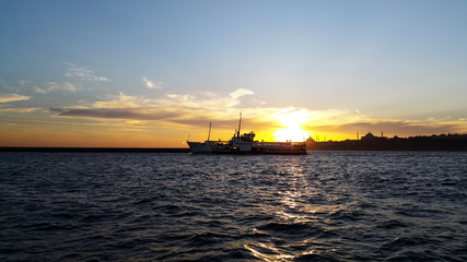 Passenger ship moves at the distant in dusk
