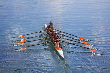 Team of rowing Four-oar women in boat - 185288495
