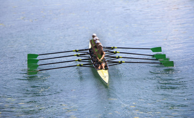 Team of rowing Four-oar women in boat