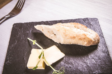 An appetizer of bread and butter served in a restaurant