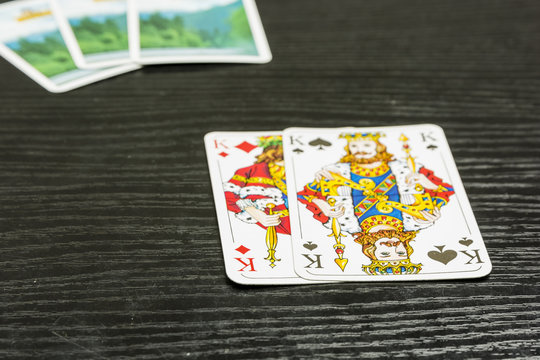 Poker game - there are two kings in the exposed playing cards.