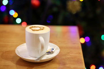 white Cup of cappuccino on bokeh background
