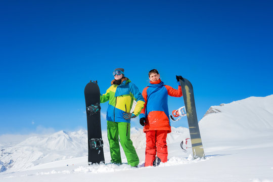 pair of snowboarders a man and a woman