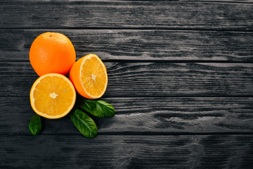 Orange on a wooden background. Top view. Free space for text.
