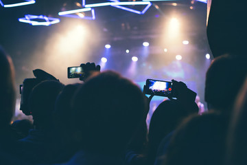 The audience is videotaping on the smartphone.