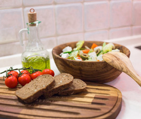 Greek salad, bread, cherry tomato and olive oil