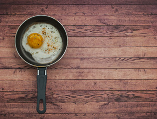 Quick and easy breakfast on wooden background. Top view with text space.