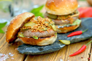 Burger grilled Nuremberg sausage outdoors