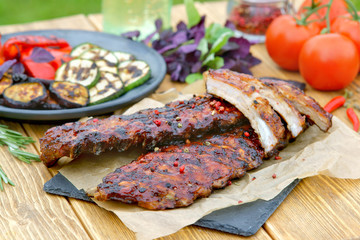 ribs with grilled vegetables outdoors