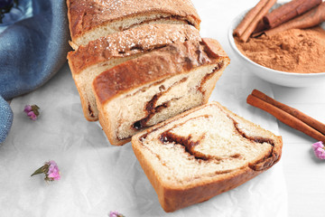 Delicious cinnamon roll cake on table