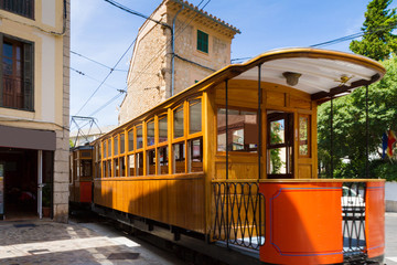 Historical railway with wooden carriages transports visitors to Soller port, Mallorca, Spain. © Stockphototrends