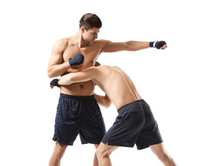 Attractive young boxers fighting on white background