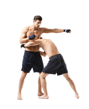 Attractive young boxers fighting on white background