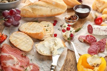 Ingredients for delicious bruschettas on table