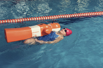 One Girl with Training Dummy in a Pool