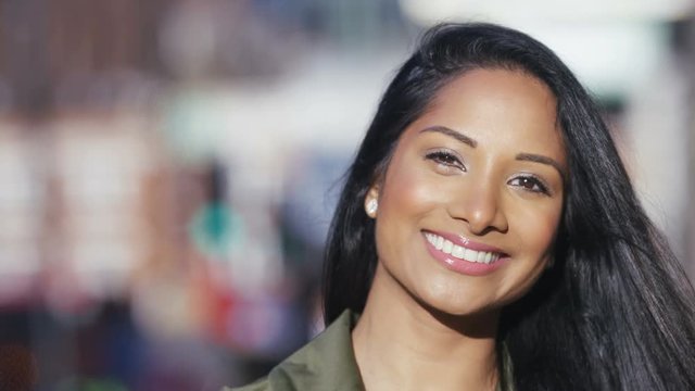 Portrait of attractive female professional smiling to camera