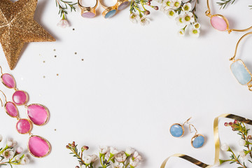 Flat lay with pink and blue necklace (2:3)