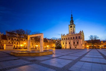 Old town square with historical town hall in Chelmno at dusk, Poland