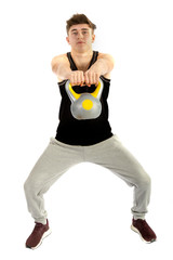18 year old teenage boy exercising with weights