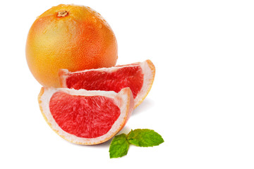 Fresh grapefruit whole and two slices with peppermint and wate