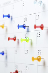 pushpins on calendar