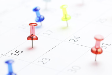 pushpins on calendar