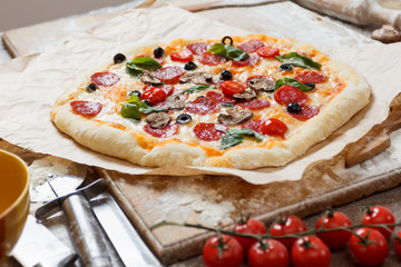 Assorted pizza with different fillings served on wooden table with ingredients