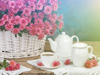 The concept of breakfast. Flowers and tea on the table. Retro Hipster Version