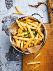 French fries on wooden table