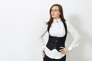 Beautiful happy caucasian young smiling brown-hair business woman in black suit, white shirt and glasses looking aside isolated on white background. Manager or worker. Copy space for advertisement.