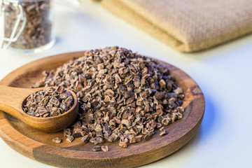 Cocoa beans and cacao powder - closeup with detail macro shot