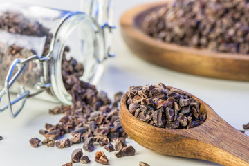 Cocoa beans and cacao powder - closeup with detail macro shot