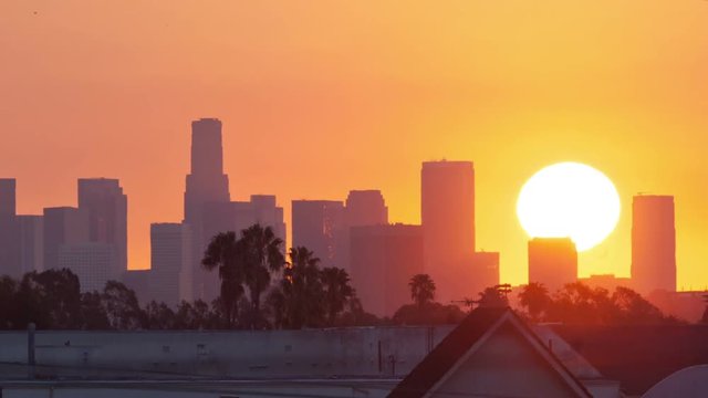 Los Angeles sunrise, timelapse. Zoom in on city skyline.