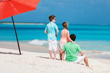 Father with kids at beach