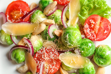 Plate with yummy brussel sprouts salad, closeup