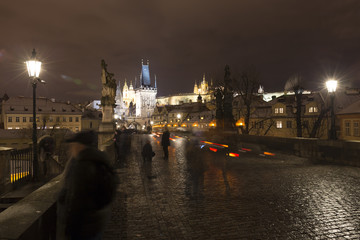 Fototapeta premium Night colorful snowy Christmas Prague Lesser Town with gothic Castle from Charles Bridge, Czech republic