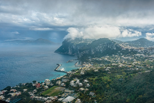 Capri Island view under cloudy sky after storm
