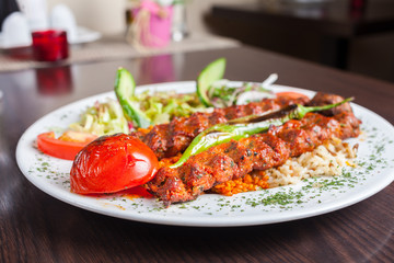 Adana kebap with vegetables