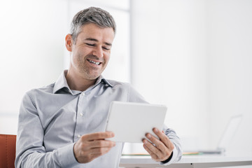 Businessman using a tablet in the office