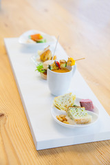 Sortiment of salmon, soup, vegetables and other delicious dishes